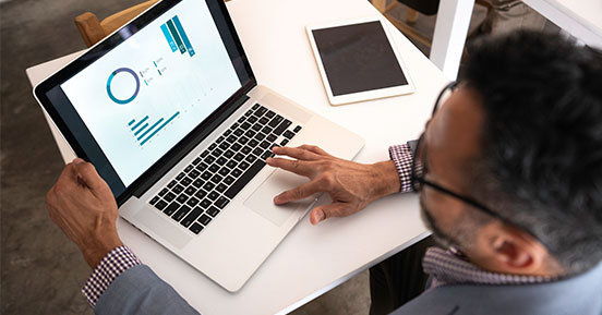 Outsourcing Digitization: The Smart Choice for Small Businesses - Man working on a computer at a table