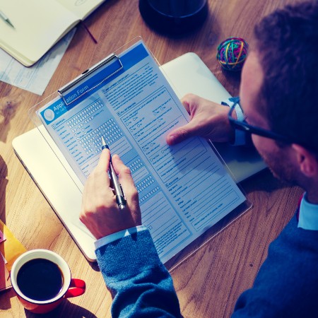 Person filling out a form