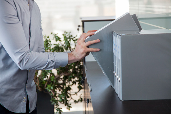 Person stacking documents