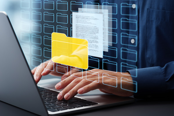 Typing on laptop file folder overlay