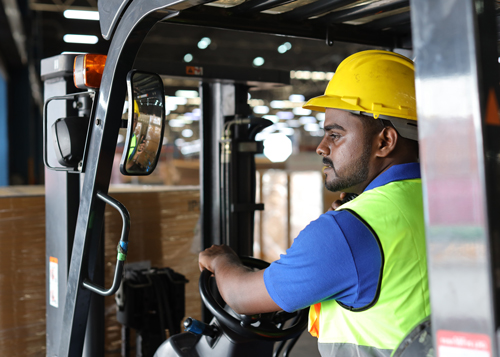 Man driving forklift