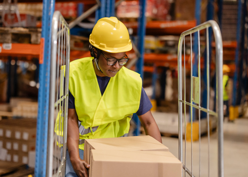Woman stacking boxes