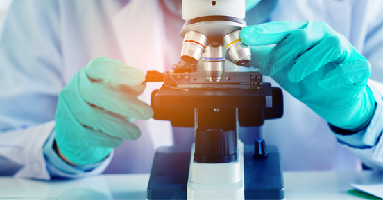 Global Healthcare Organisation Stabilises Records Operations With Dedicated Staff | viewing a microscope