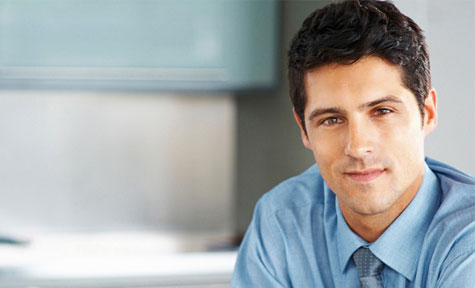 businessman smilling at the camera