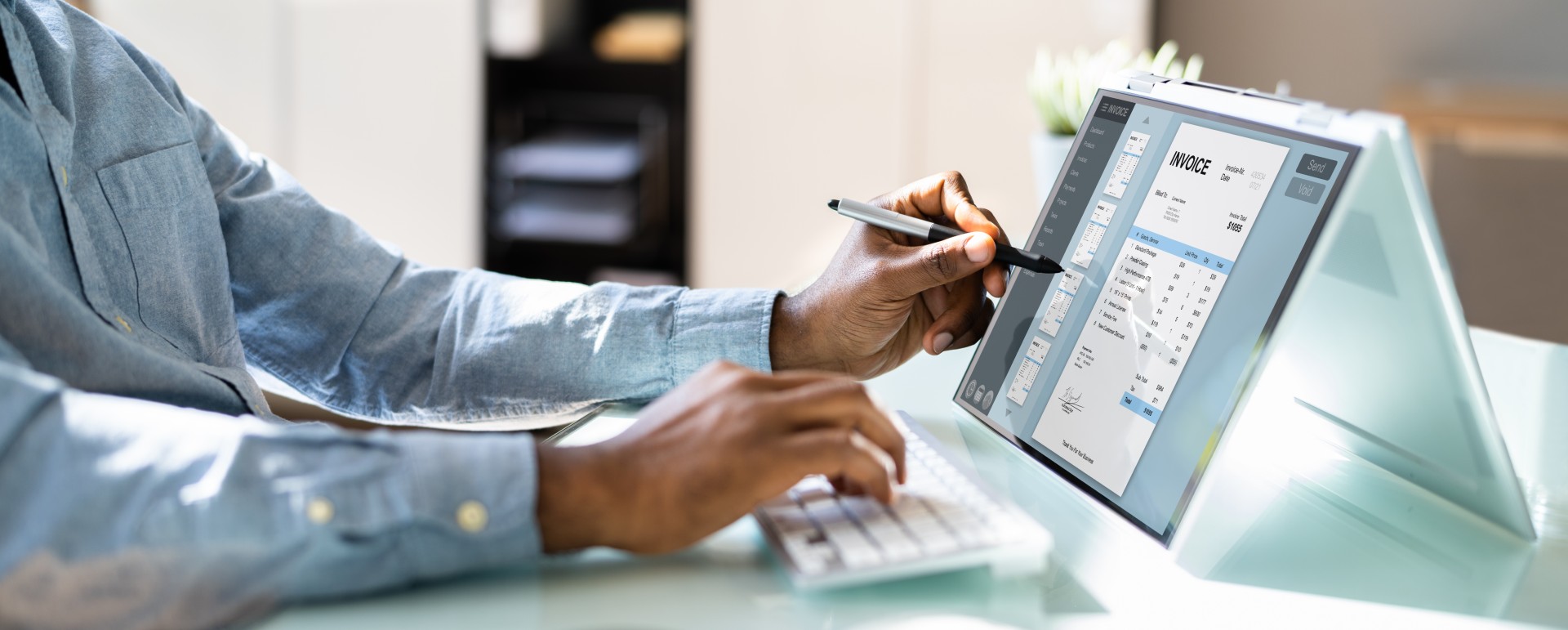 Man using a tablet to view an invoice